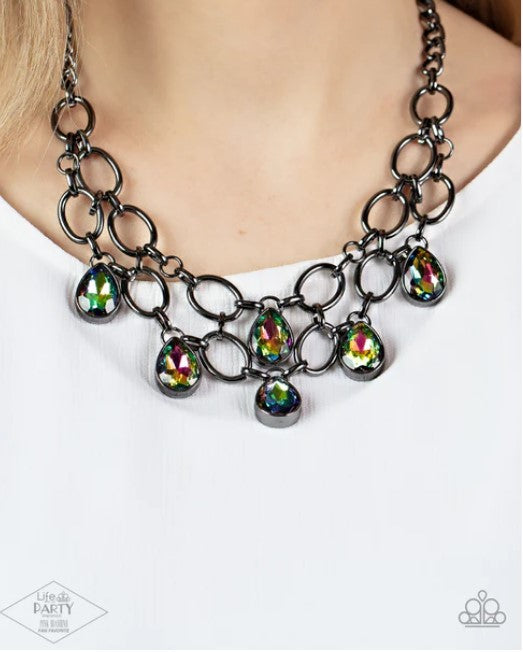 A black multi-strand necklace with oil spill teardrop gems and dainty metal links, featuring an adjustable clasp closure.